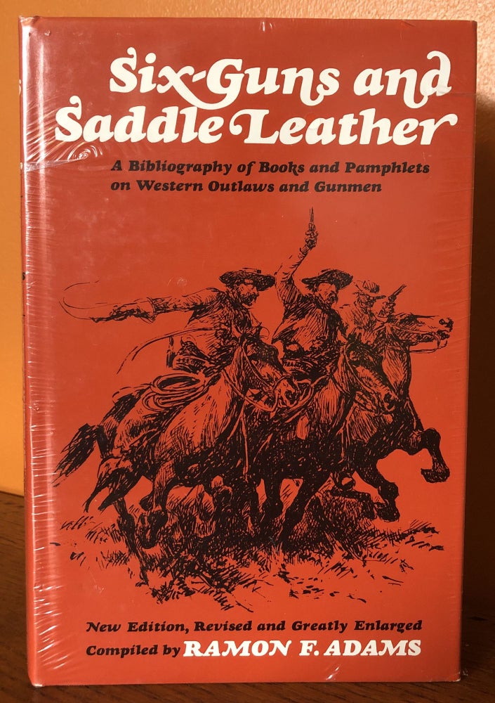 Item #51115 SIX-GUNS AND SADDLE LEATHER: A Bibliography of Books and Pamphlets on Western Outlaws and Gunmen. Ramon Adams.